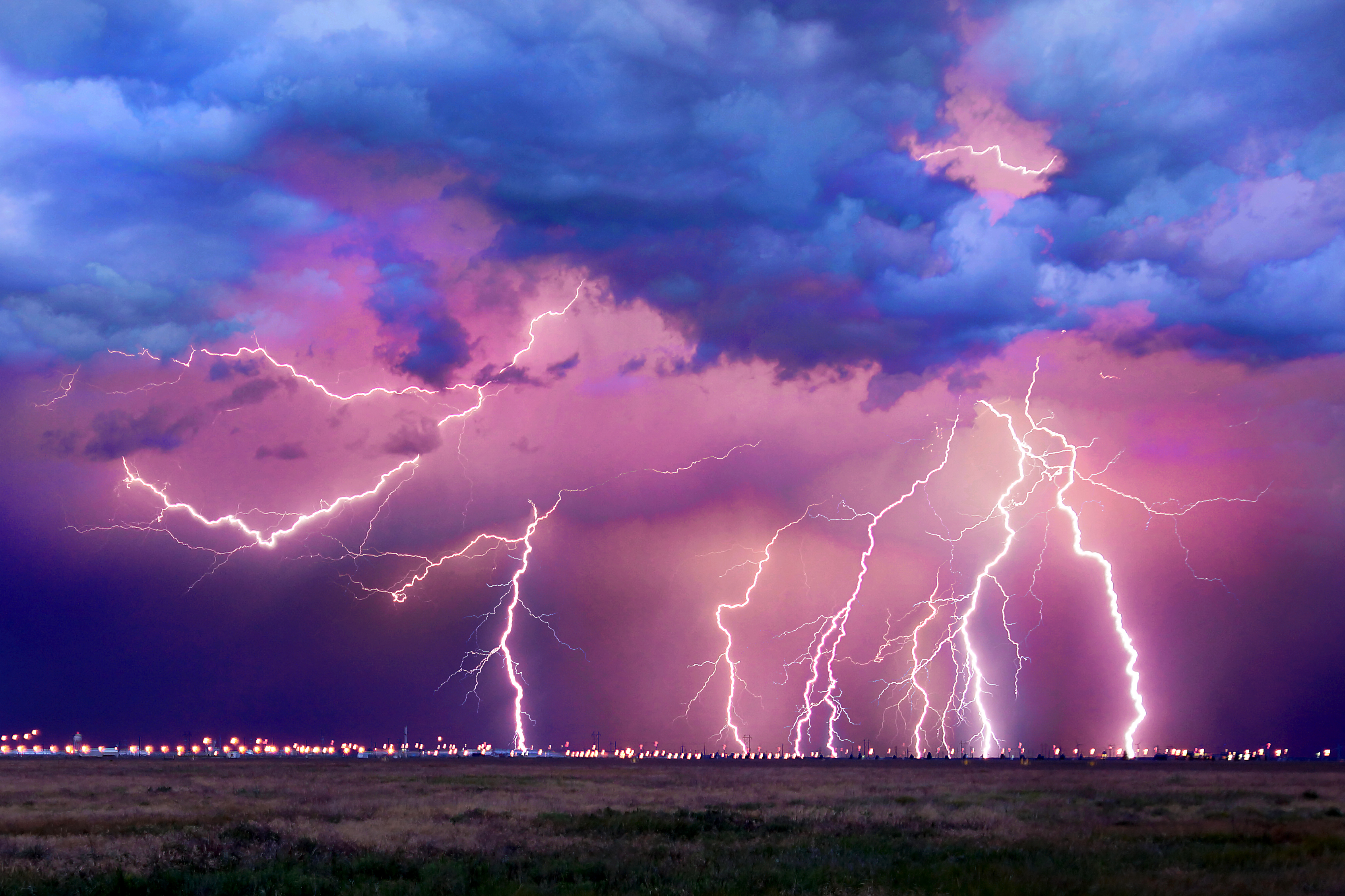 Ground-strike lightning rolling over the Pantex Plant. Ground-strike lightning rolling over the Pantex Plant.