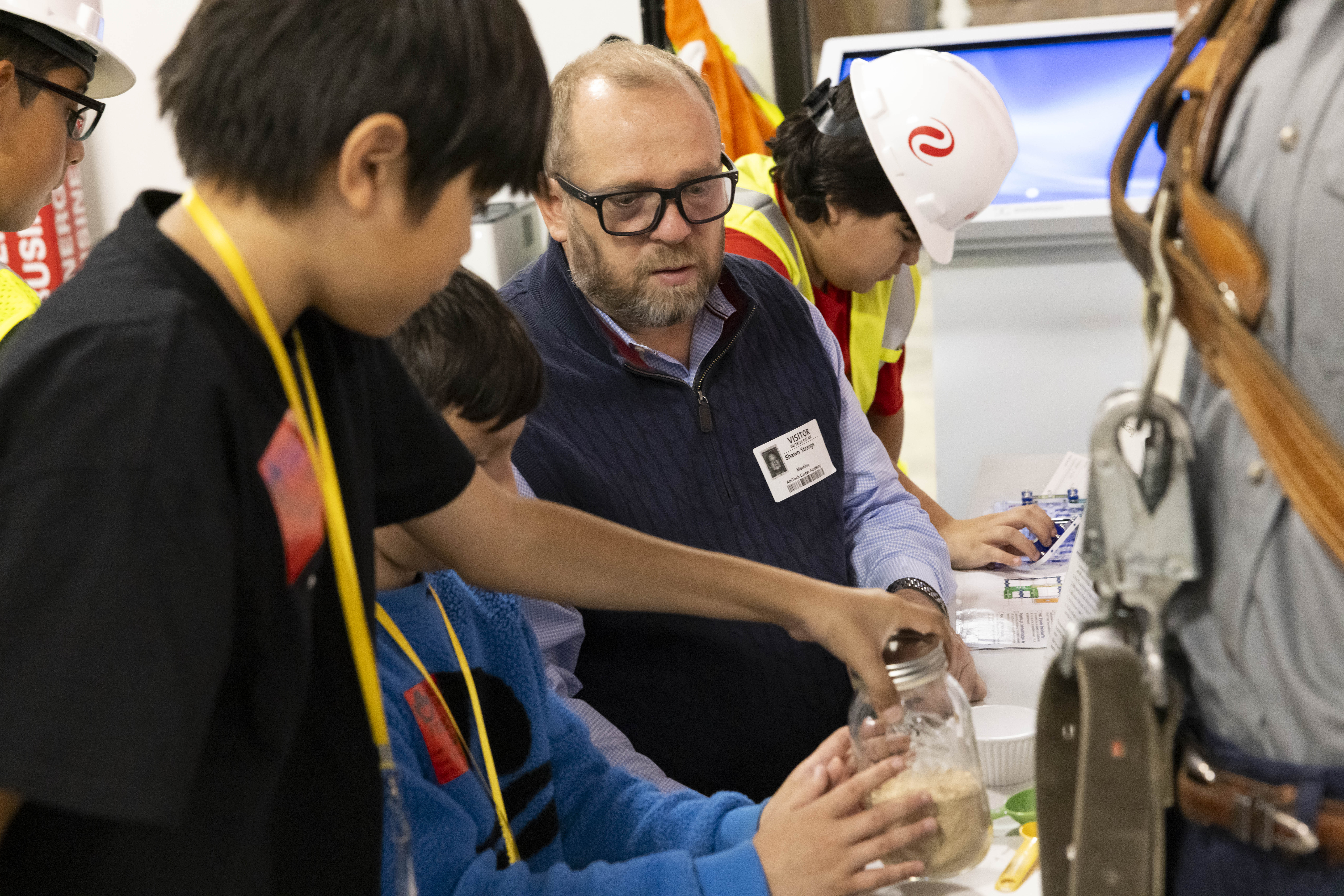 Pantexan Shawn S. interacting with students at JA BizTown. Pantexan Shawn S. interacting with students at JA BizTown.