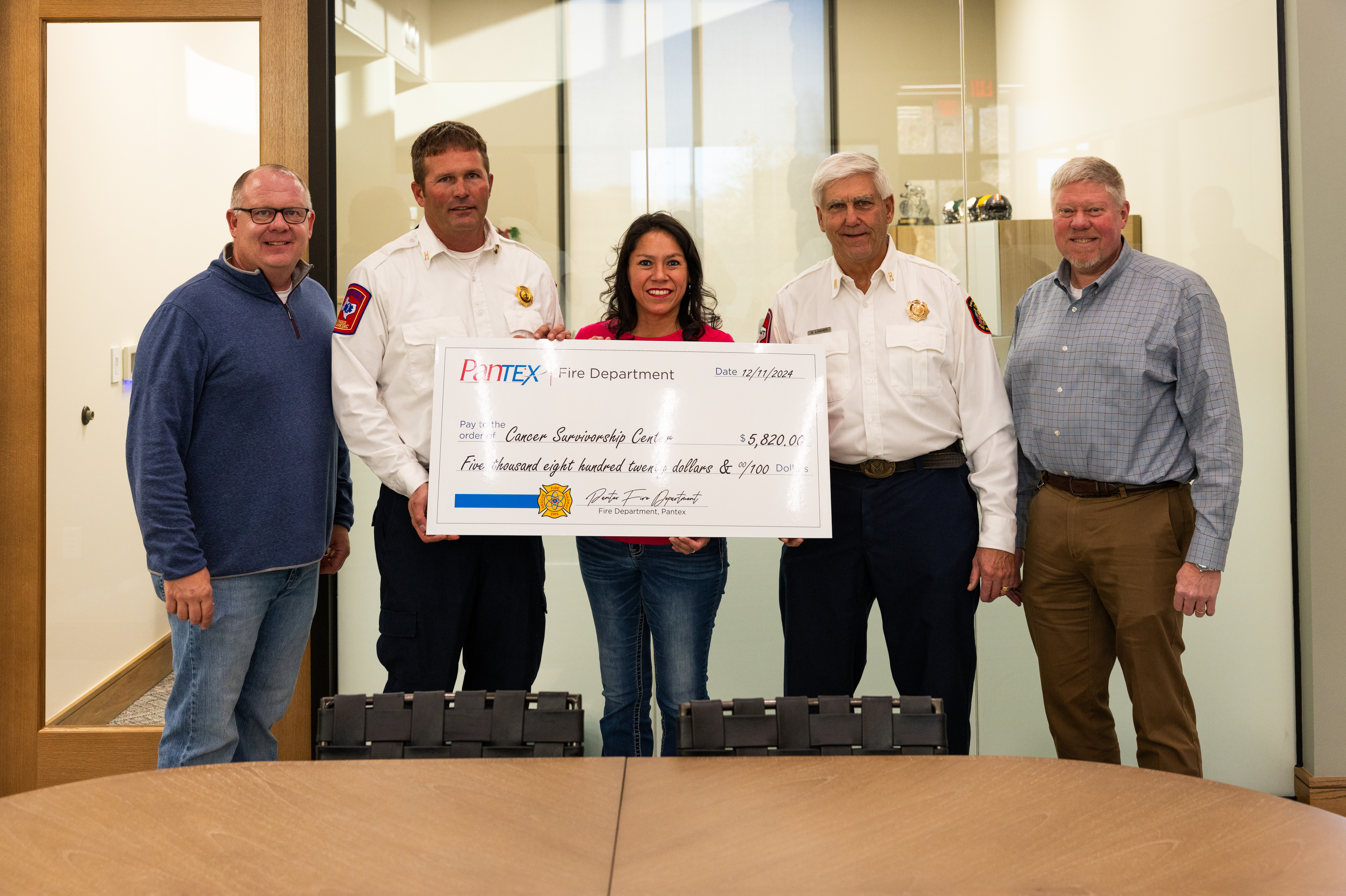 The fire department donated money raised from the “give cancer the axe” T-shirt fundraiser to 24 Hours in the Canyon Cancer Survivorship Center on December 11. The fire department donated money raised from the “give cancer the axe” T-shirt fundraiser to 24 Hours in the Canyon Cancer Survivorship Center on December 11.