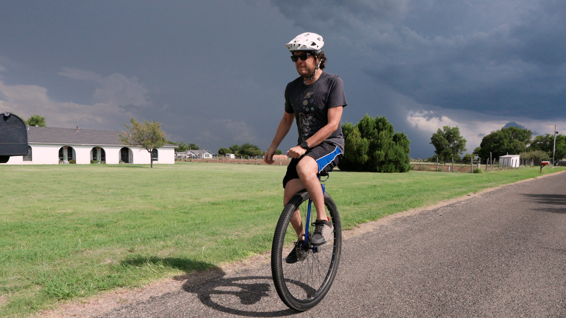 Bryce Garrett riding a unicycle. Bryce Garrett riding a unicycle.