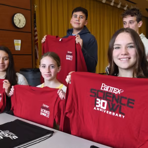 Bushland Middle School shows off their Pantex Science Bowl 30th anniversary shirts and bags