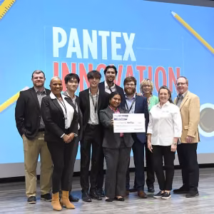 Texas A&M students from the AutoTech Inc team with their third-place prize. 